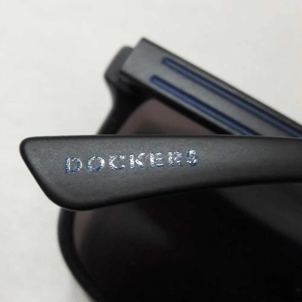 Dockers Unisex Sunglasses Blue Lens Black Frame UVA-UVA Protection Unise…
